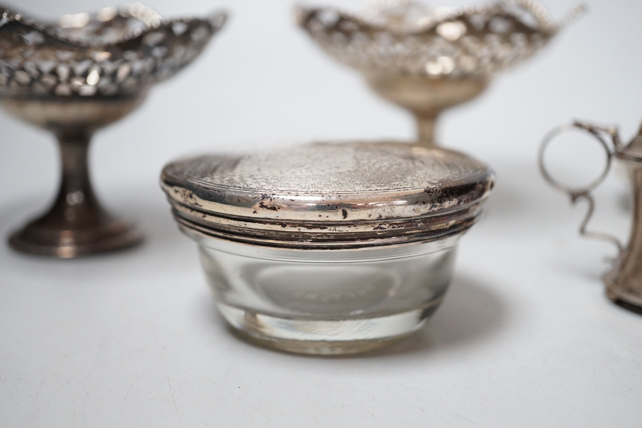 Sundry small silver including a late Victorian silver waiter, Birmingham, 1899, 14.5cm, two silver mounted toilet jars, a silver mustard pot and pair of silver pedestal tazzes.